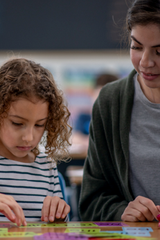 teacher and students doing a literacy exercise
