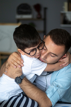 man comforting child