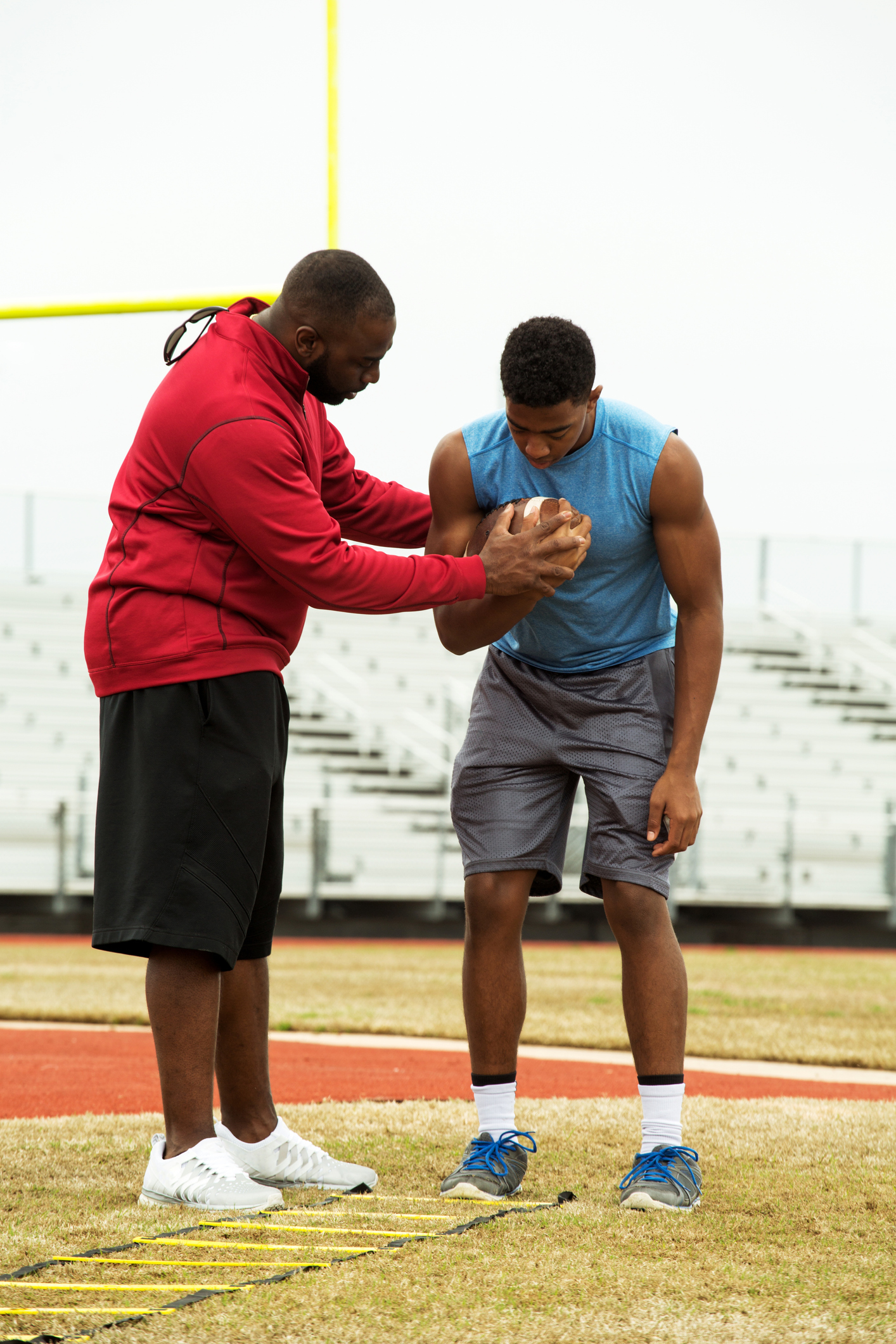 Coach with boy athlete