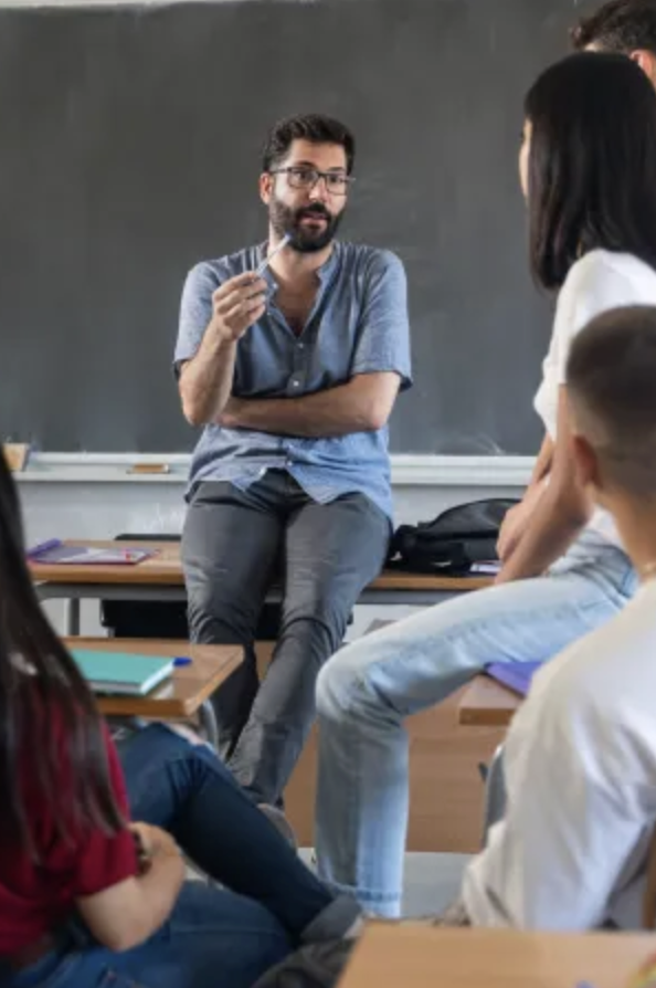 Teacher talking with students