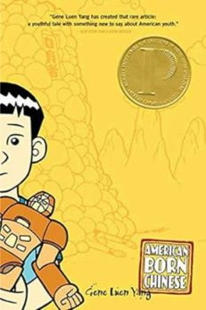 "Cover of the graphic novel 'American Born Chinese' by Gene Luen Yang, featuring a stylized illustration of a boy holding a transformer-like toy. The background is yellow with subtle images of mountains and the Monkey King, and a gold award medal is displayed in the top right corner."