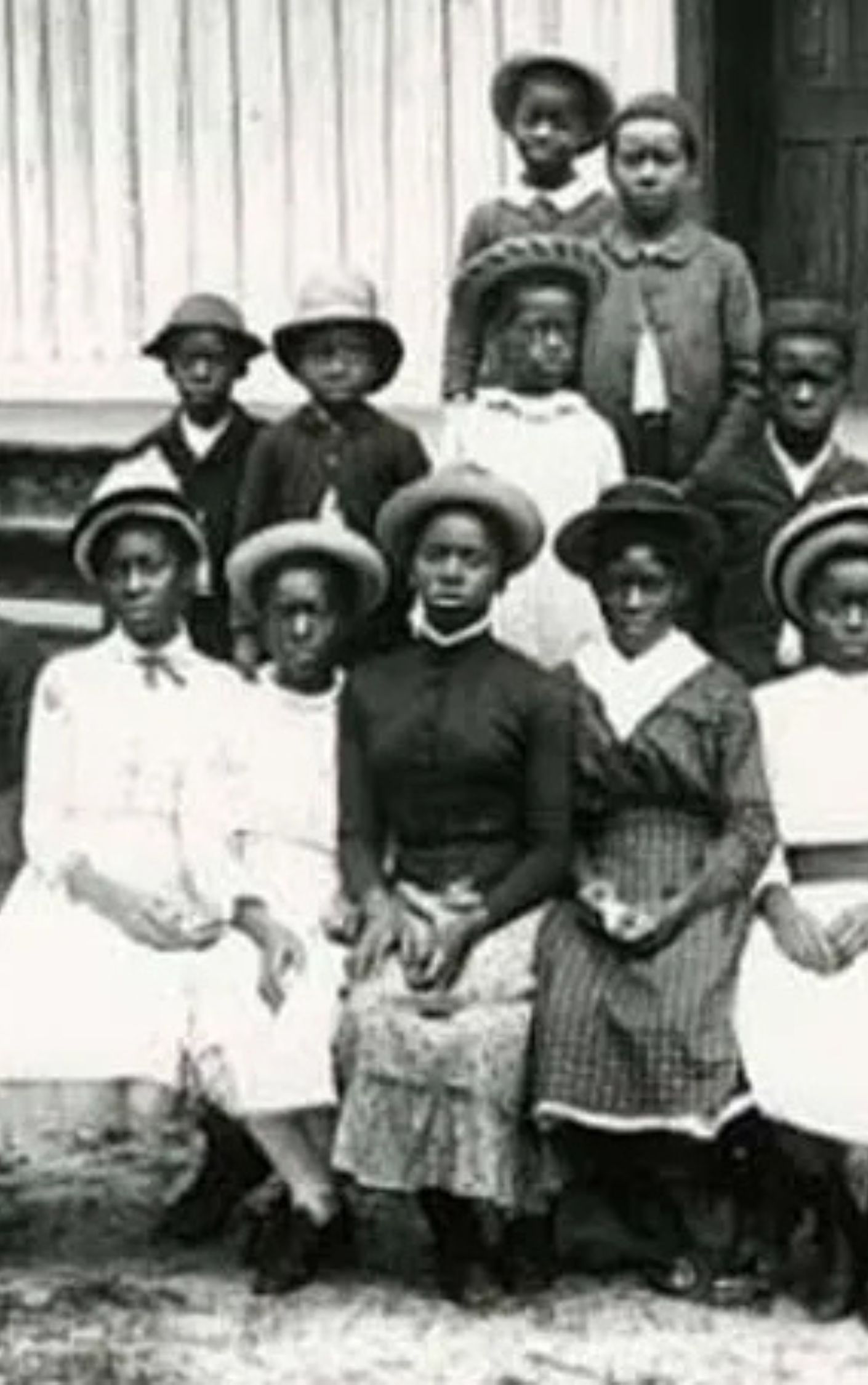 Historic photograph of African American children in the Reconstruction era, likely attending school, symbolizing the newly claimed right to education and freedom after Emancipation. This image reflects the pursuit of dignity, self-determination, and equality during the Reconstruction period.