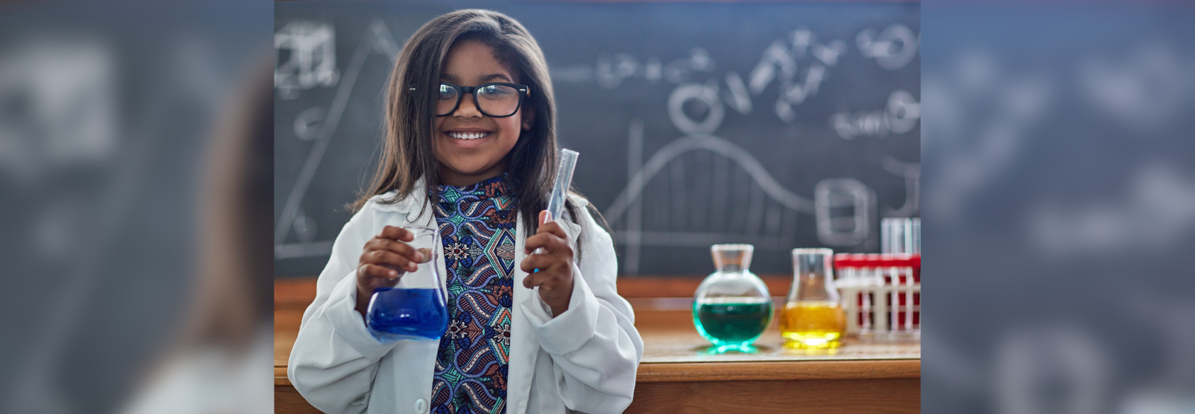 student holding a beaker