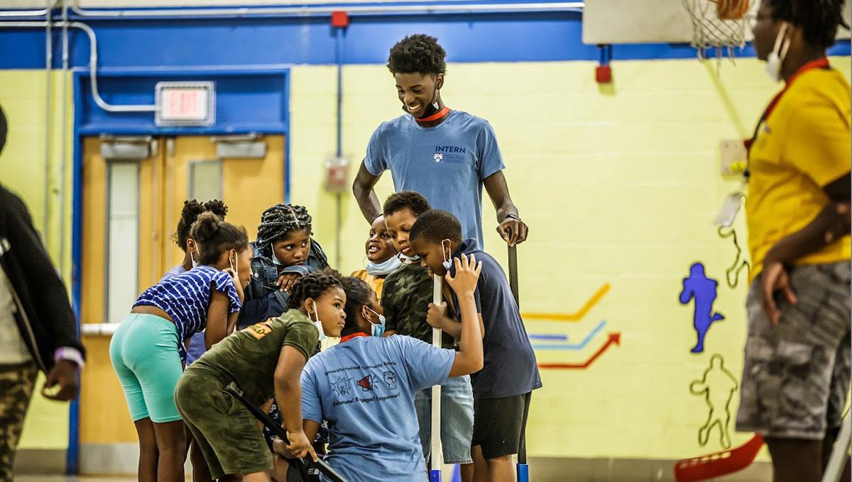 A community school program connects university students with children in after-school activities.
