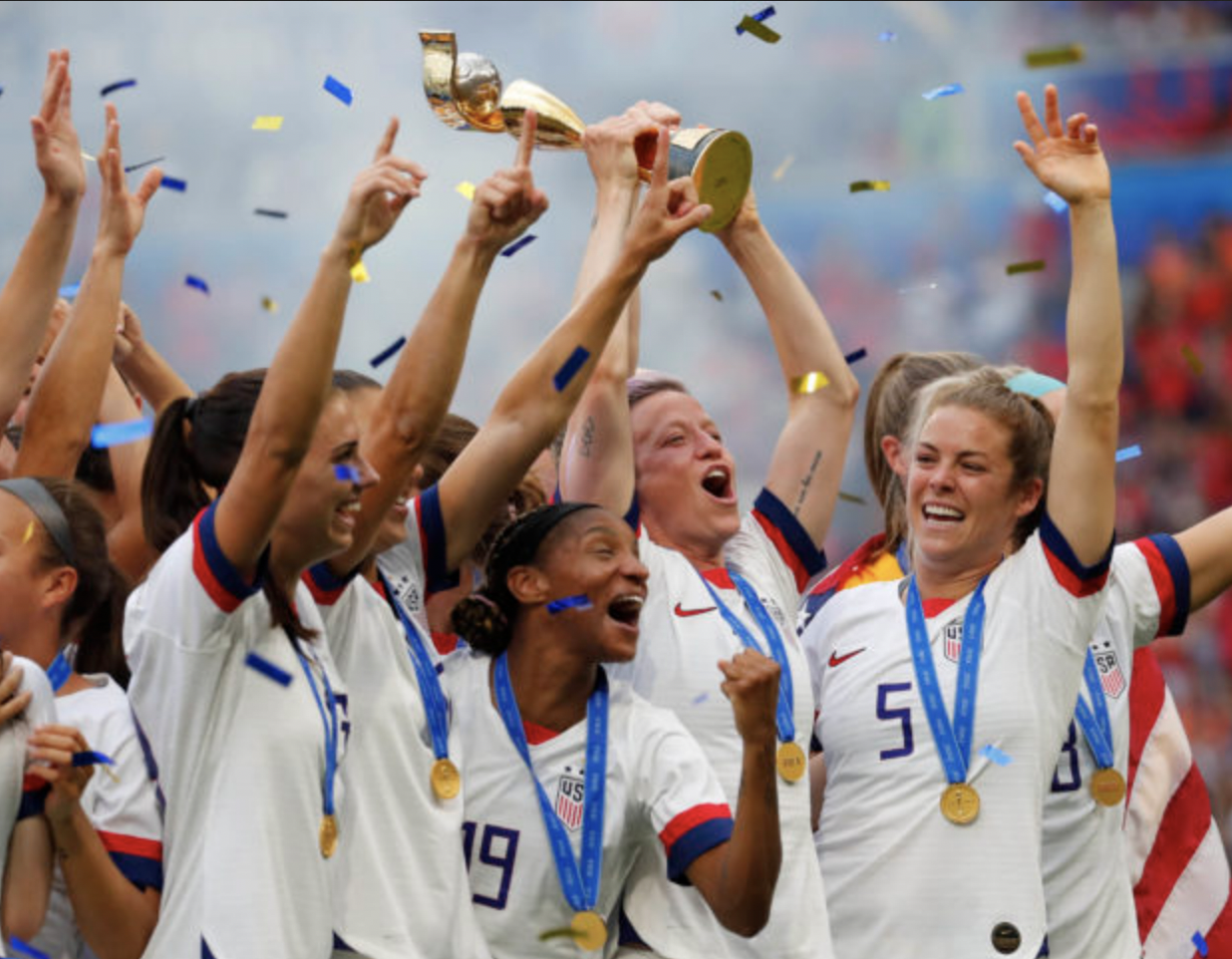  U.S. Women's Soccer team with world cup trophy