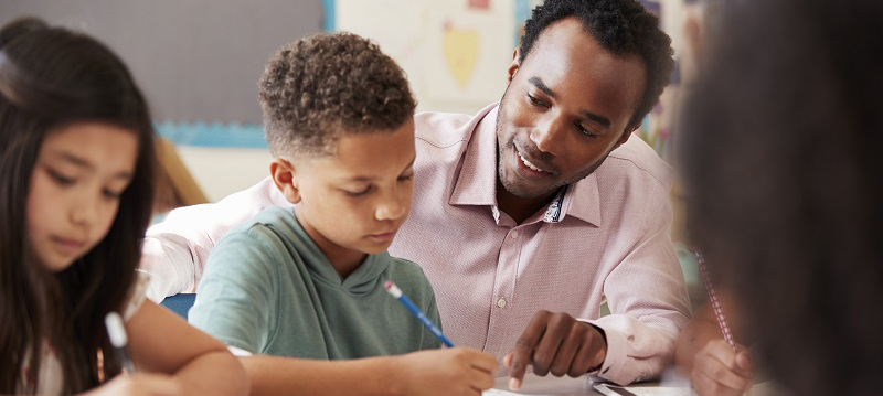 Teacher engaging in strategies to counter childhood adversity.